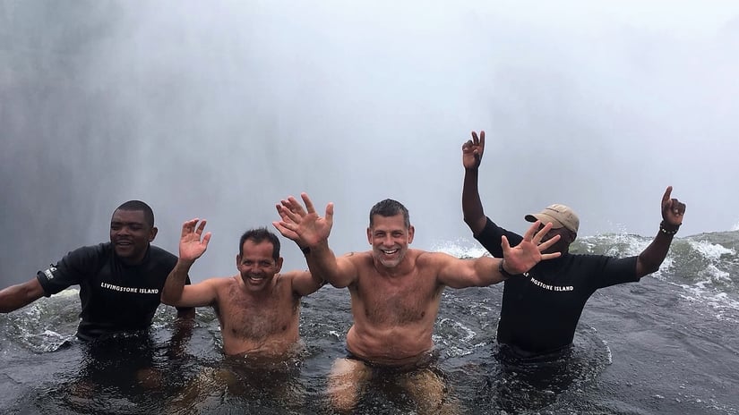 Our Founder Mitch Swimming in Victoria Falls