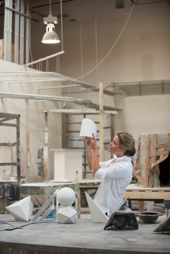 Amy Meier working on her new line of geometric sculptures for Stone Yard